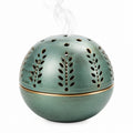 Bruciatore di incenso sferico Ø 15 cm in ceramica verde con trafori decorativi